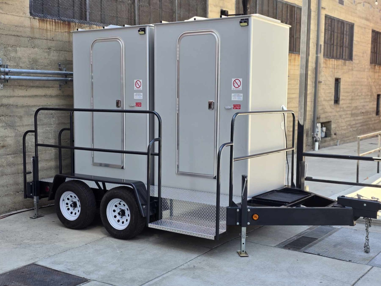 Two private Diplomat restrooms on a trailer