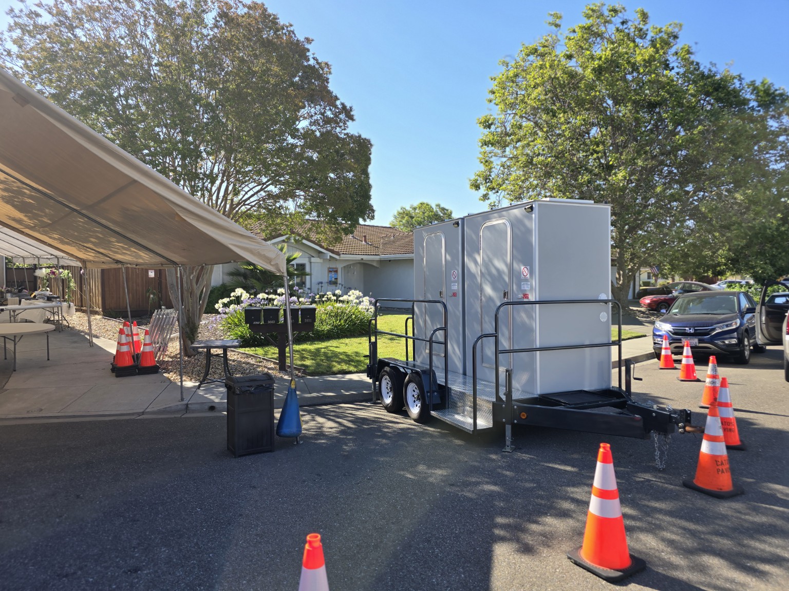Solar Loo trailer beside an outdoor event tent
